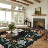 Covaba boho modern parisian floral scalloped area rug in ink black, styled in a room setting