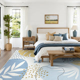 Covaba modern botanical leaf area rug in stormy blue, styled in a room setting, view 9