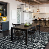 Covaba modern rustic farmhouse moroccan tribal black/white area rug in soft white, styled in a room setting, view 3