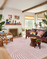 Covaba abstract rainbow stripe pink/white area rug in blush clay, styled in a room setting, view 13
