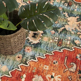 Covaba boho vintage tribal round rug in burnt rust, styled in a room setting, view 2