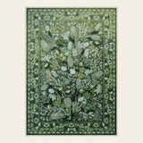 Covaba modern botanical floral area rug in fern green, shown flat on a plain ivory backdrop