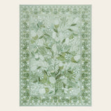 Covaba modern botanical floral area rug in sage mist, shown flat on a plain ivory backdrop