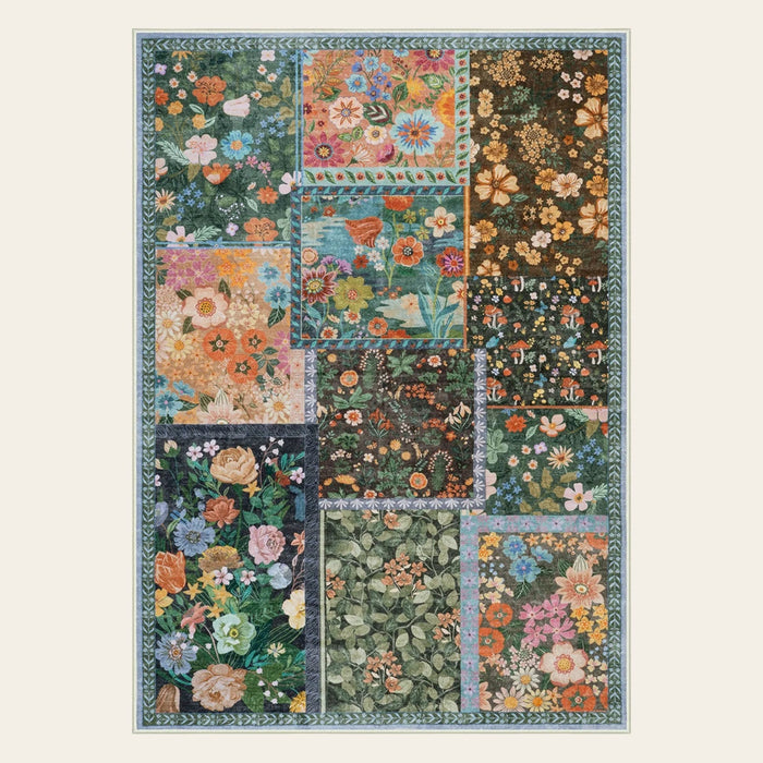 Covaba patchwork cottagecore floral area rug in multicolor, shown flat on a plain ivory backdrop