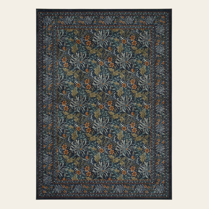 Covaba boho vintage floral area rug in forest fern, shown flat on a plain ivory backdrop