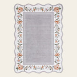 Covaba vintage floral scalloped doormat in muted plum, shown flat on a plain ivory backdrop