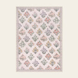 Covaba meadow floral area rug in blush clay, shown flat on a plain ivory backdrop