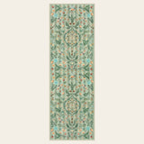 Covaba boho insect botanical floral runner rug in fern green, shown flat on a plain ivory backdrop