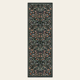 Covaba maximalism vibrant blossom floral runner rug in ink black, shown flat on a plain ivory backdrop