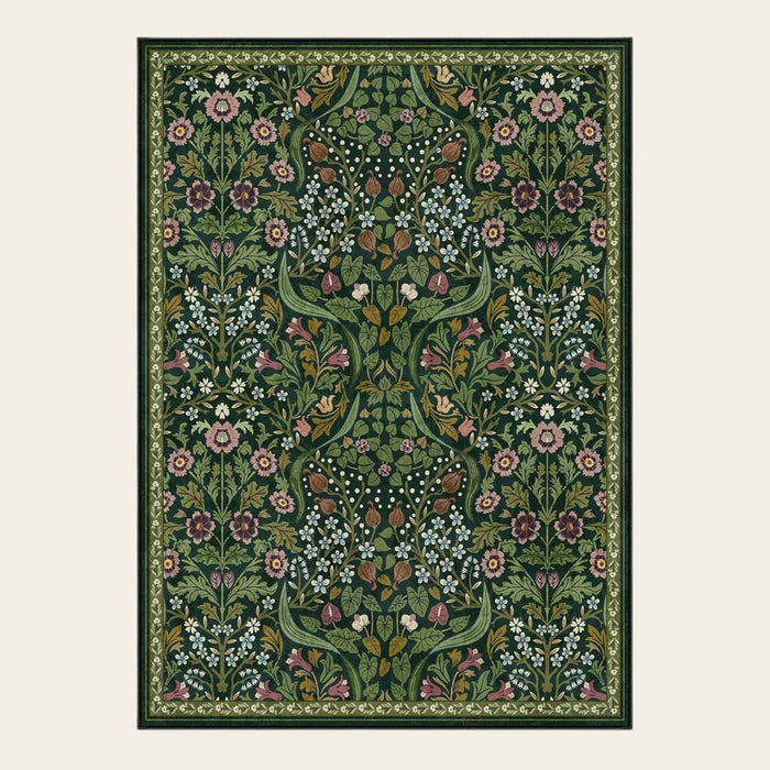 Covaba maximalism vibrant blossom floral area rug in forest fern, shown flat on a plain ivory backdrop