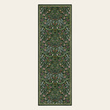 Covaba maximalism vibrant blossom floral runner rug in forest fern, shown flat on a plain ivory backdrop