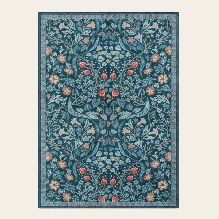 Covaba maximalism vibrant floral area rug in teal haze, shown flat on a plain ivory backdrop