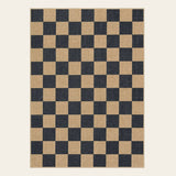 Covaba checkered easy jute natural indoor/outdoor doormat in ink black, shown flat on a plain ivory backdrop
