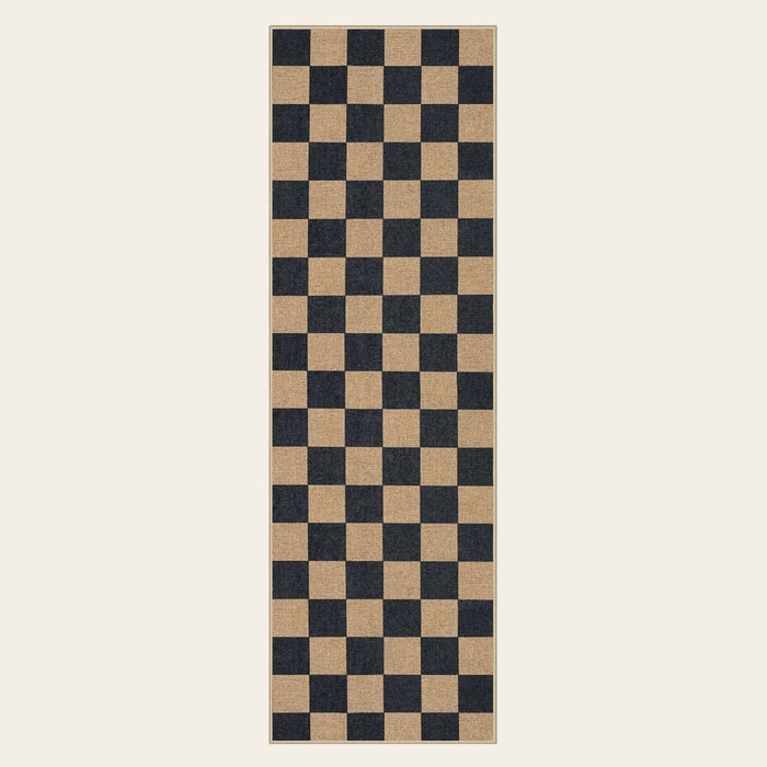 Covaba checkered easy jute natural indoor/outdoor runner rug in ink black, shown flat on a plain ivory backdrop