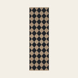Covaba geometric checkered easy jute indoor/outdoor runner rug in coffee brown, shown flat on a plain ivory backdrop