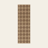 Covaba geometric checkered easy jute indoor/outdoor runner rug in dune khaki, shown flat on a plain ivory backdrop