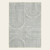 Covaba abstract rainbow stripe black/beige area rug in warm beige, shown flat on a plain ivory backdrop