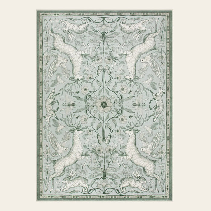 Covaba vintage woodland area rug in willow sage, shown flat on a plain ivory backdrop