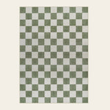 Covaba modern checkerboard area rug in olive grove, shown flat on a plain ivory backdrop