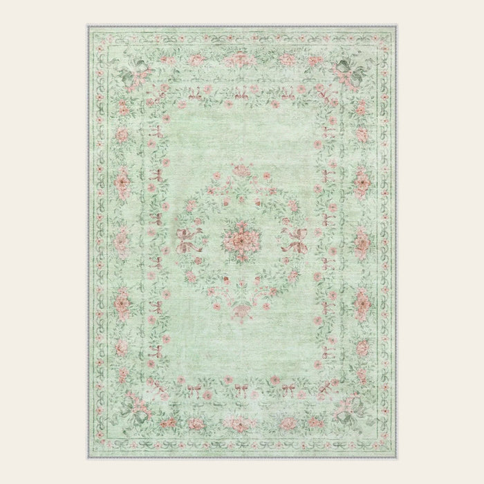Covaba vintage traditional floral area rug in fern green, shown flat on a plain ivory backdrop