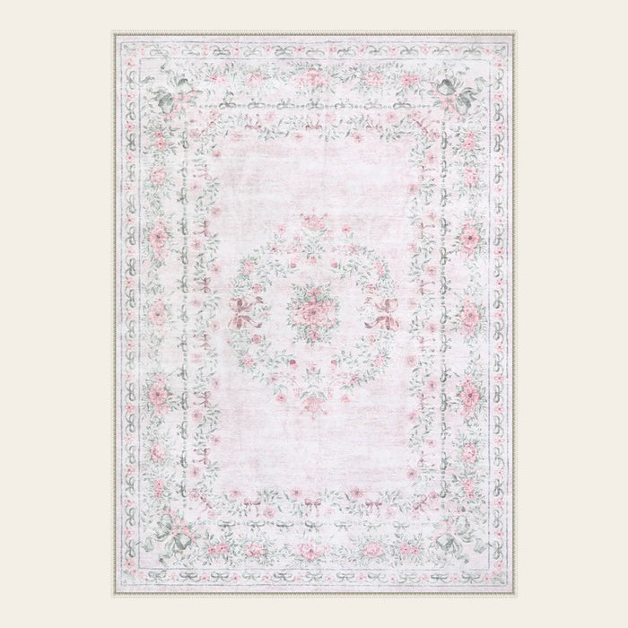 Covaba vintage traditional floral area rug in blush clay, shown flat on a plain ivory backdrop