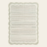 Covaba modern abstract bordered scalloped area rug in warm beige, shown flat on a plain ivory backdrop