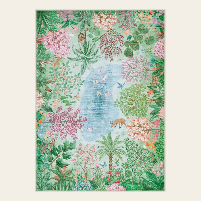 Covaba jungle botanical spring area rug in fern green, shown flat on a plain ivory backdrop
