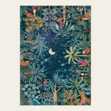 Covaba jungle midnight area rug in stormy blue, shown flat on a plain ivory backdrop