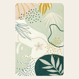 Covaba modern botanical leaf area rug in fern green, shown flat on a plain ivory backdrop