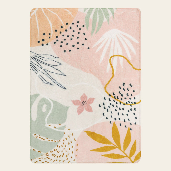 Covaba modern botanical leaf area rug in blush clay, shown flat on a plain ivory backdrop