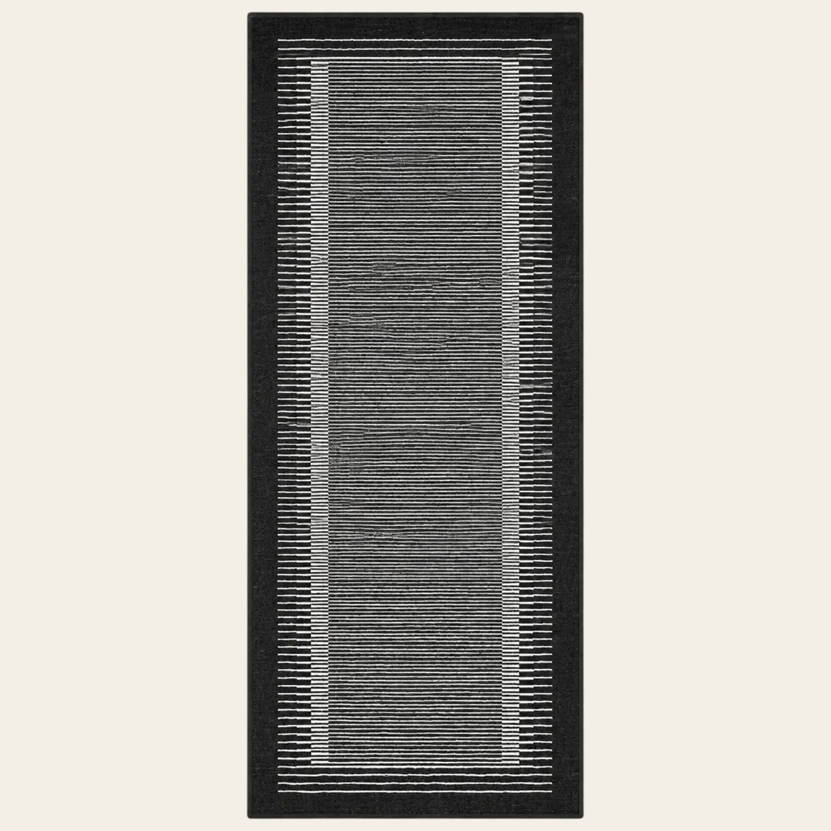 Covaba modern minimalist line runner rug in ink black, shown flat on a plain ivory backdrop