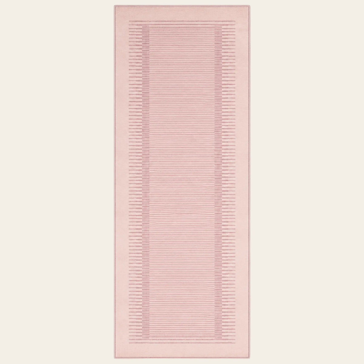 Covaba modern minimalist line runner rug in blush clay, shown flat on a plain ivory backdrop