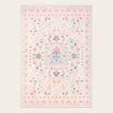 Covaba vintage persian floral area rug in blush clay, shown flat on a plain ivory backdrop