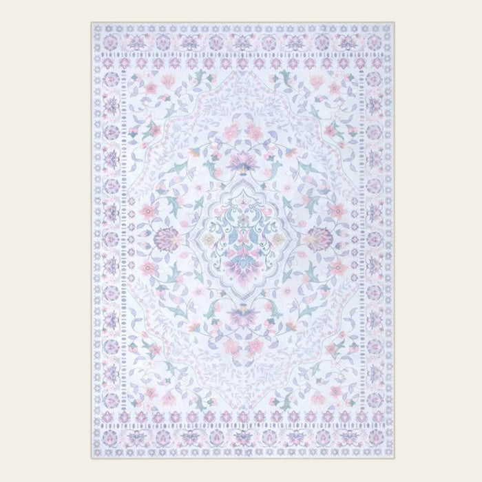 Covaba vintage persian floral area rug in muted plum, shown flat on a plain ivory backdrop