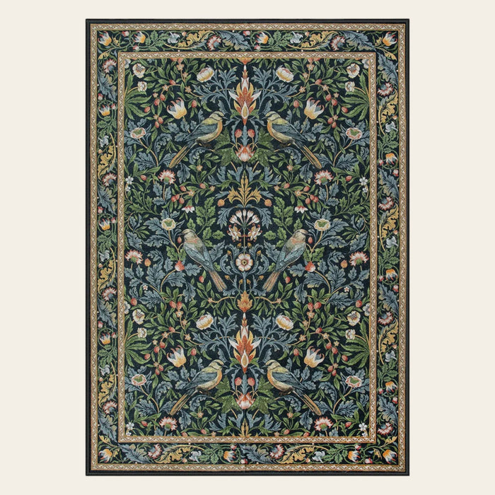 Covaba vintage floral bird area rug in deep navy, shown flat on a plain ivory backdrop