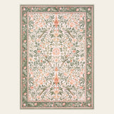 Covaba vintage floral bird area rug in blush clay, shown flat on a plain ivory backdrop