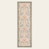 Covaba vintage floral bird runner rug in blush clay, shown flat on a plain ivory backdrop