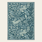Covaba vintage woodcut forest and rabbit doormat in stormy blue, shown flat on a plain ivory backdrop