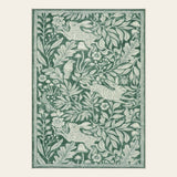 Covaba vintage woodcut forest and rabbit doormat in fern green, shown flat on a plain ivory backdrop