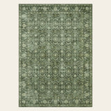 Covaba vintage persian distressed area rug in fern green, shown flat on a plain ivory backdrop