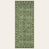 Covaba vintage persian distressed runner rug in fern green, shown flat on a plain ivory backdrop