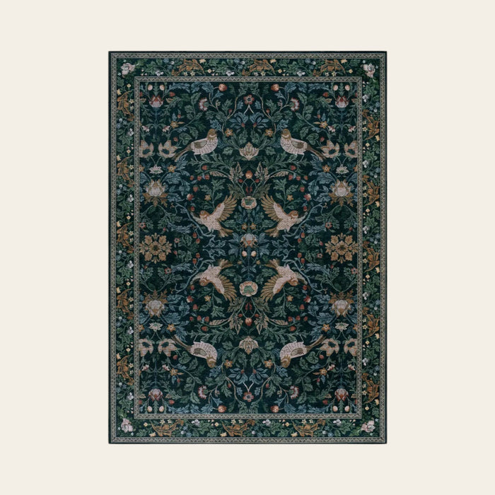 Covaba botanical bird garden chenille area rug in ink black, shown flat on a plain ivory backdrop