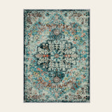 Covaba bohemian floral medallion doormat in teal haze, shown flat on a plain ivory backdrop