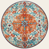 Covaba bohemian floral medallion round rug in amber clay, shown flat on a plain ivory backdrop