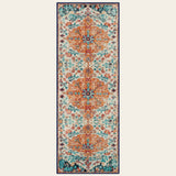 Covaba bohemian floral medallion runner rug in amber clay, shown flat on a plain ivory backdrop