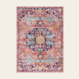 Covaba bohemian floral medallion area rug in faded rose, shown flat on a plain ivory backdrop