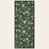 Covaba vintage botanical floral runner rug in fern green, shown flat on a plain ivory backdrop