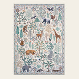 Covaba jungle animals area rug in warm beige, shown flat on a plain ivory backdrop