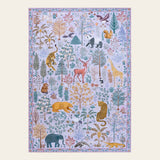 Covaba jungle animals area rug in muted plum, shown flat on a plain ivory backdrop