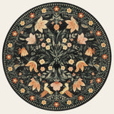 Covaba boho birdsong floral garden round rug in ink black, shown flat on a plain ivory backdrop